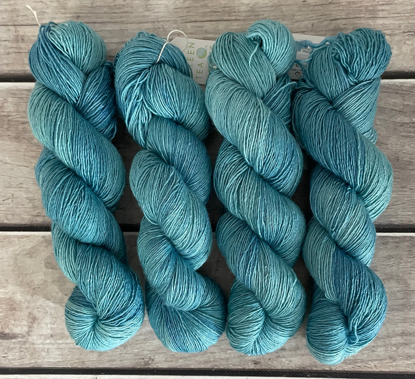 Turquoise bay Dark - on Merino and Silk 4 ply single - Osmanthus