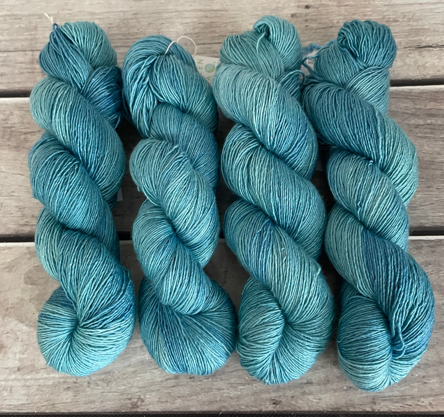 Turquoise bay Dark - on Merino and Silk 4 ply single - Osmanthus