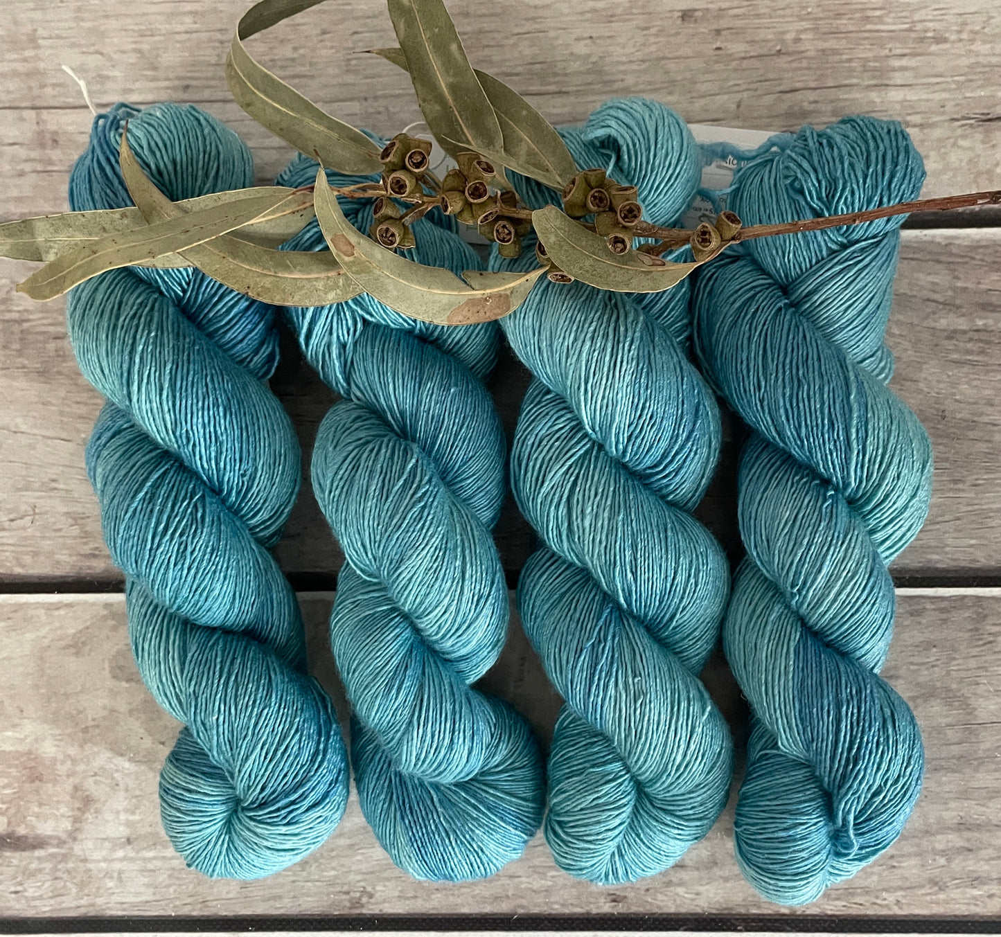 Turquoise bay Dark - on Merino and Silk 4 ply single - Osmanthus