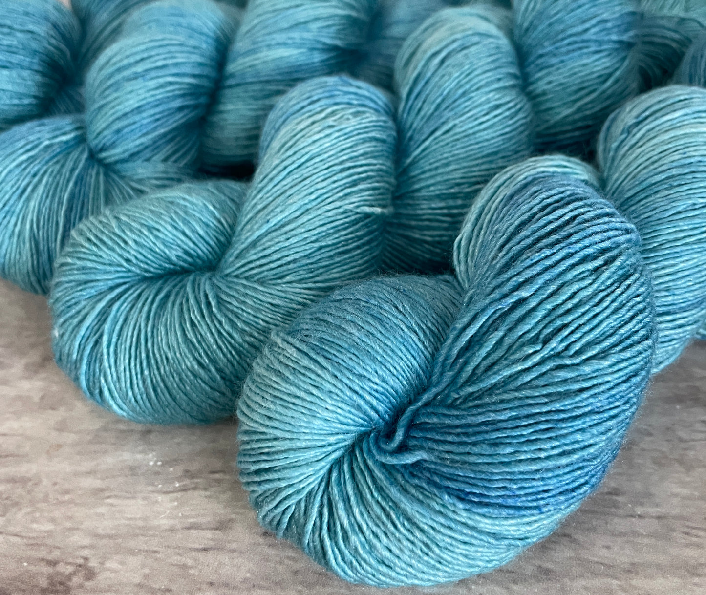 Turquoise bay Dark - on Merino and Silk 4 ply single - Osmanthus