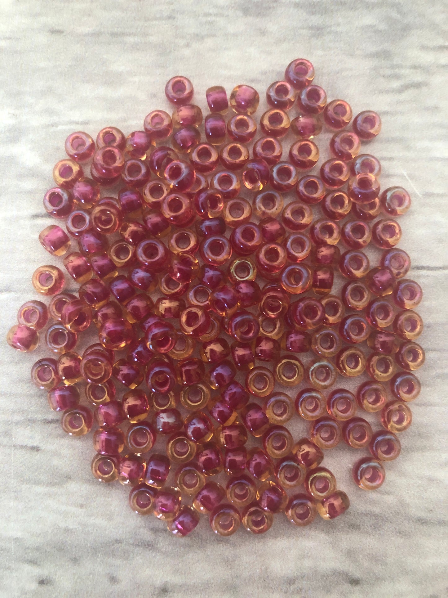 Miyuki 6 - Cranberry lined Topaz AB