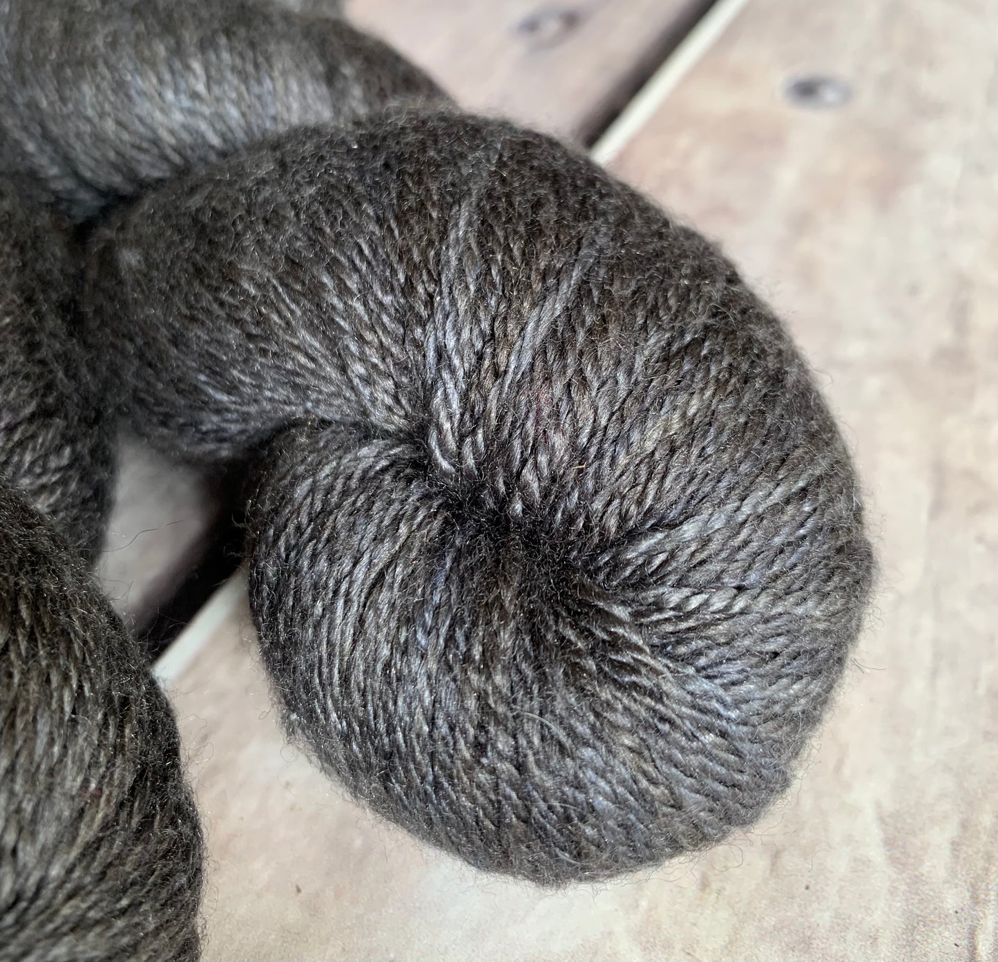 A cool grey colour on a merino/silk 4 ply base.