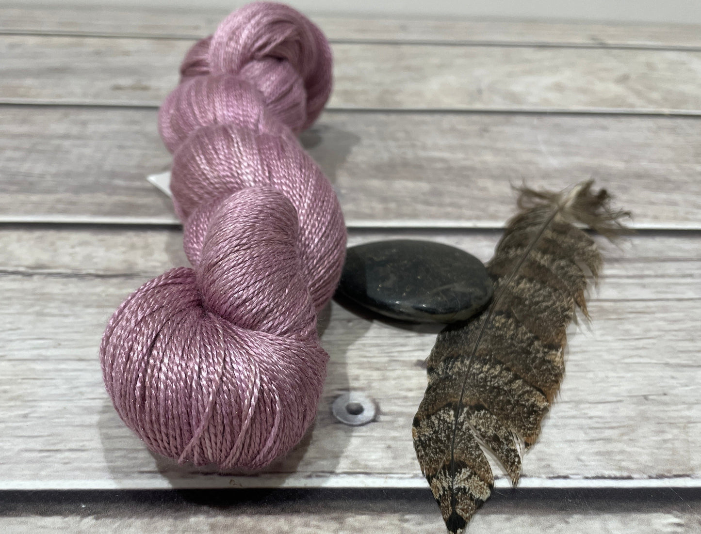 a skein of pure silk in a soft muted pink colour